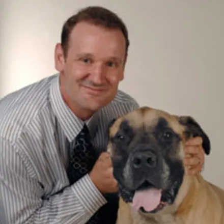 J. Clifton Crooks next to a large dog